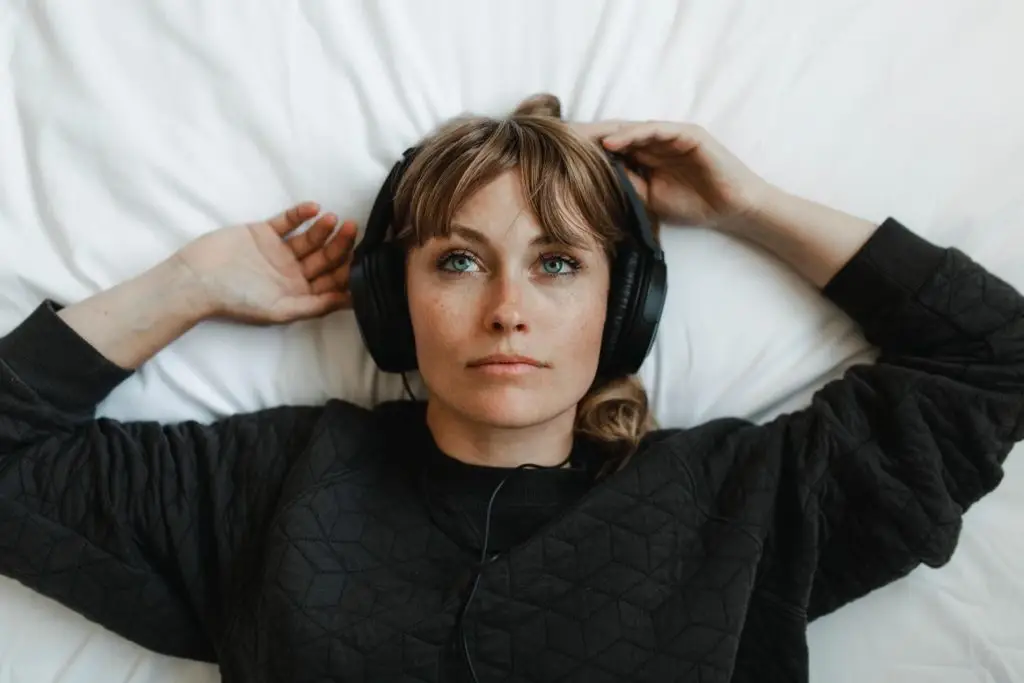 Woman listening to music at home during coronavirus pandemic